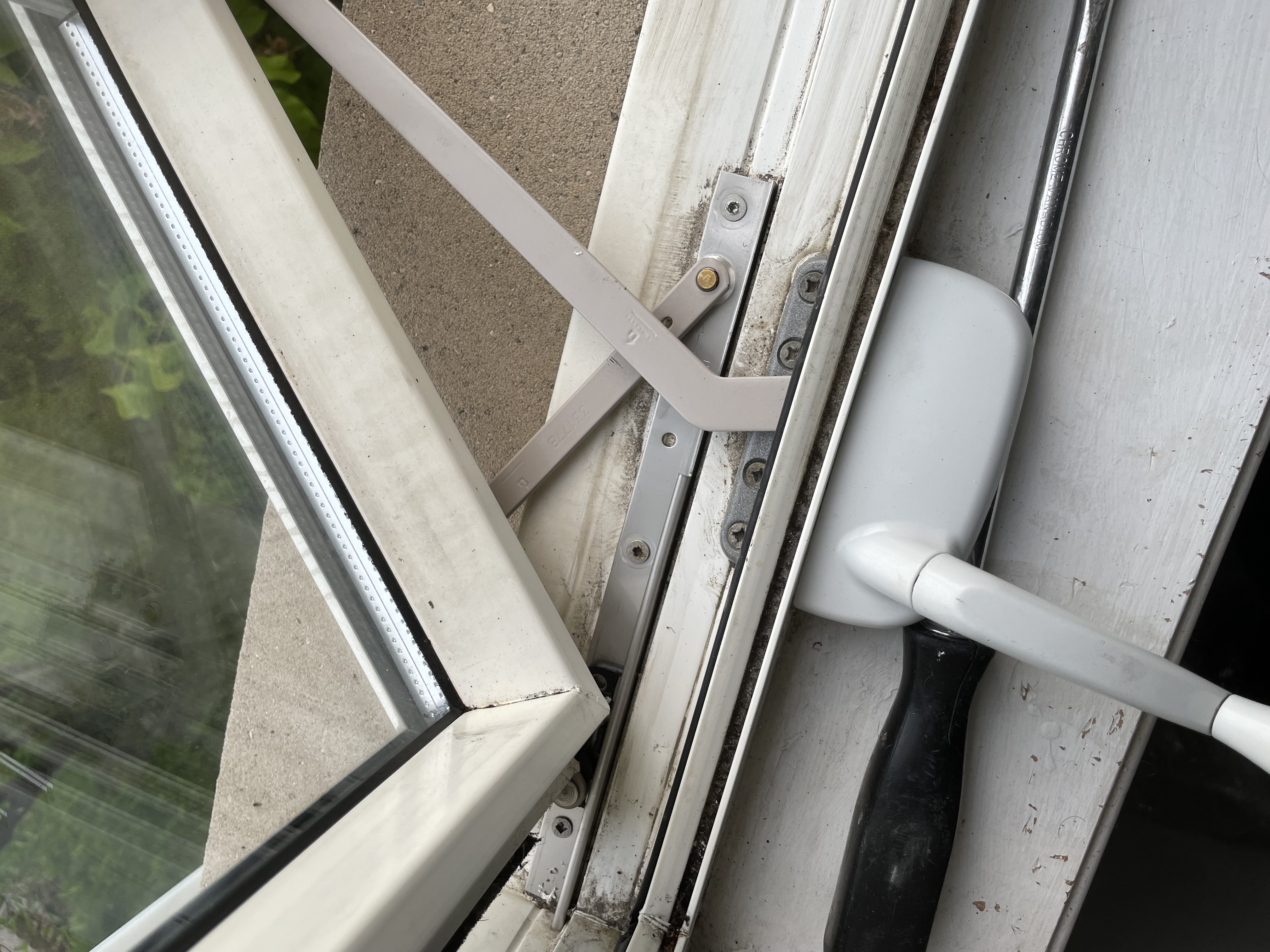 Window cranks and hardware repair in Mississauga, featuring replaced hinges.