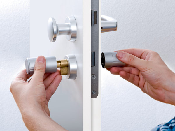Door repairs by Window Fix GTA in Toronto, showing a newly installed lock and handle.